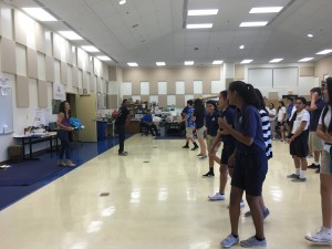 Jenn Eng and Ken Elliot coach students at a mock dance audition for Career Day