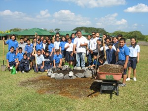 The current 5th graders planting the first kukui tree of the mala. 