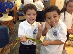 Garrin and Paliku got the "hilo" twist of the ti-leaves down and had fun too..maikaʻi loa boys!